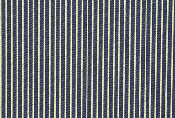 Dark blue denim with yellow stripes fabric background