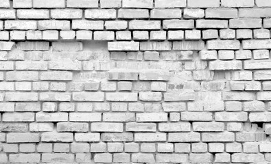 Old destroyed brick wall. Monochrome background