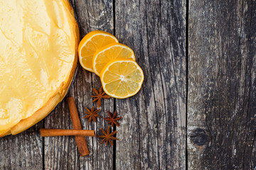 Lemon meringue pie on rustic wooden background.