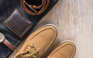Close up vintage leather shoes man accessory. Men's casual outfits with accessories on rustic wood background.