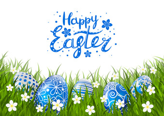 Blue Easter eggs on green grass