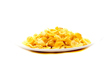 Falling flakes breakfast cereal isolated on white background. Healthy breakfast.