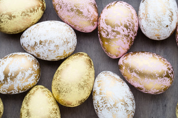 Easter eggs painted in colors on a pattern background.