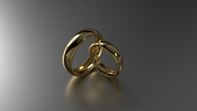 Couple of beauty gold wedding rings on black background. 3d rendering