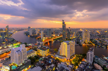 Fototapeta na wymiar Aerial view of Bangkok modern office buildings, condominium, living place in Bangkok city downtown with sunset scenery, Bangkok is the most populated city in Southeast Asia.Bangkok , Thailand