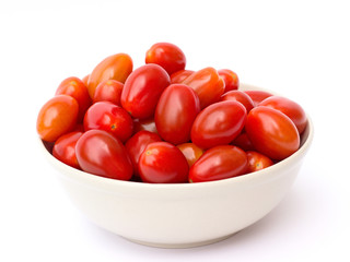 tomatoes in a bowl on a white background