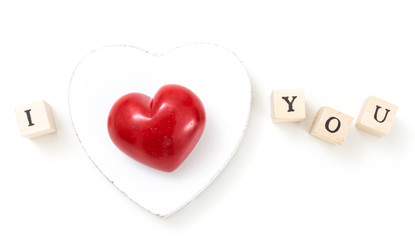 Red heart and wooden cubes with I and You, on white background. I love you concept.