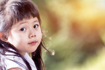 Cute Asian baby Smiling in garden.