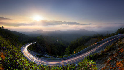 The Long road in to nature , morning mist sunrise at  Doi  Inthanon, Chiang Mai, Thailand .