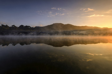 Morning mist at  Ban Rak Thai , a popular tourist attraction . Mae Hong Son province, North of Thailand .