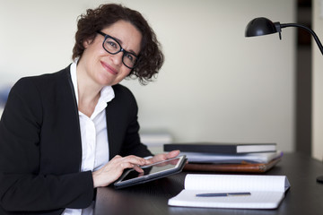 Spanish Businesswoman Smiling At the Camera. At the office.