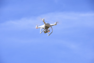 The drone with the professional camera takes pictures . New tool for aerial photo and video.
