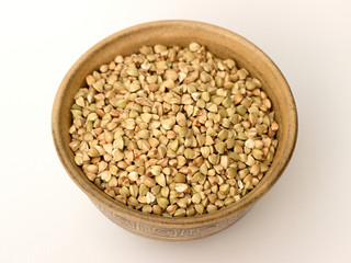 Buckwheat in a bowl on a white background