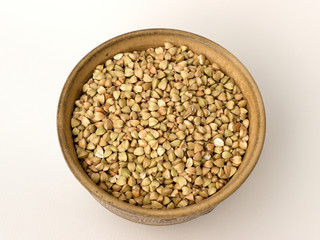 Buckwheat in a bowl on a white background
