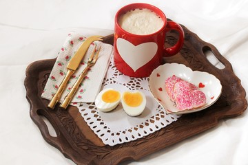Heart shaped Hard boiled egg served with Coffee Latte / Valentine's day Breakfast in bed concept