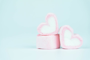 Candy hearts on a blue background / heart represents love in Valentine's Day / wedding day.