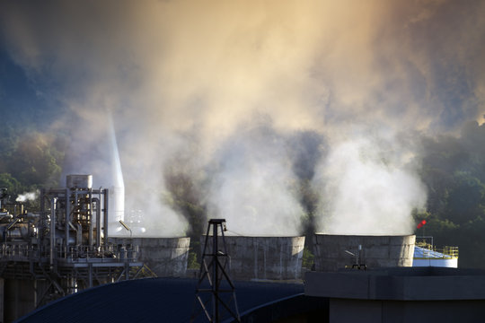 smoke from chimneys . Utility plant at Oil Refinery industry . pollution concept .
