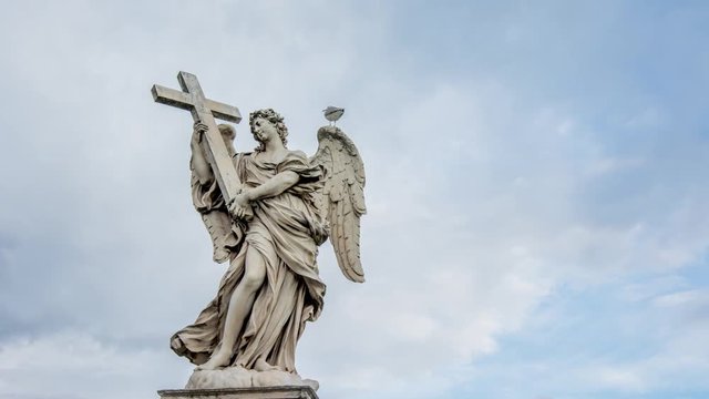 Holy angel with the cross, at Ponte Sant' Angelo, Rome, Italy. Time lapse
