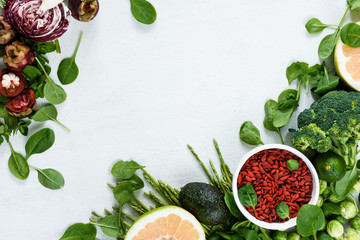 Sping greens and goji berries pattern top view