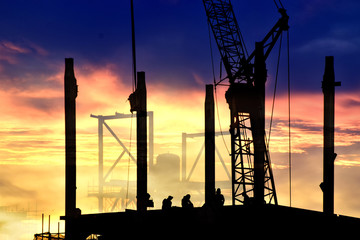 Construction site .Silhouette structural steel beam build large residential buildings at construction site .
