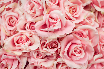 Bouquet pink artificial roses for background.