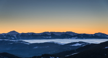 Fototapeta na wymiar Winter landscape with sunset in mountains