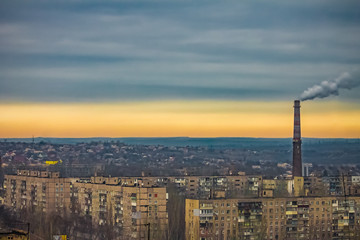 apartment buildings district and factory background, air pollution