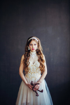 Fashion photo of sad girl wearing wedding dress