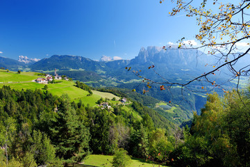 Scenic view of small Alpine village located in South Tyrol, Renon/Ritten region, Italy - obrazy, fototapety, plakaty