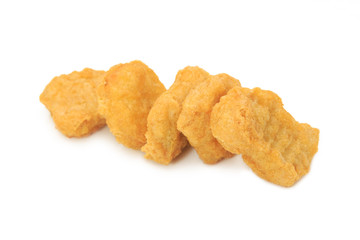 Fried chicken nuggets isolated on white background.