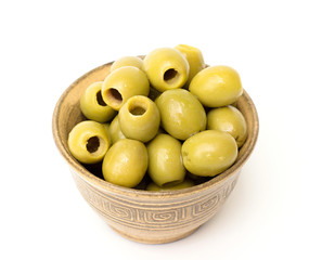 green olives in a bowl on a white background