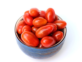 cherry tomatoes in a bowl on a white background