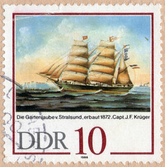 UKRAINE - CIRCA 2017: A stamp printed in DDR, shows Die Gartenlaube (built in 1872) at Stralsund, by J.F.