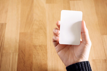 Woman holding blank business card