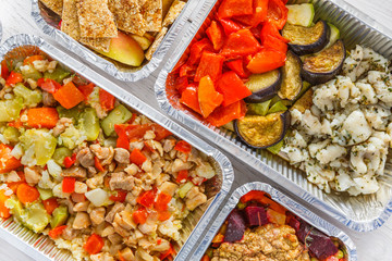Healthy food take away, top view at wood background
