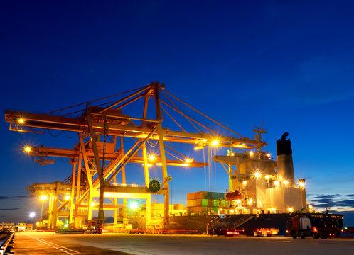 Containers are discharging from vessel  in port of Thailand