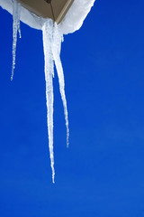 Icicles Hanging from Rooftop of Home Melted Ice Dripping