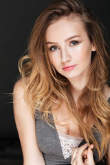 Fototapeta premium Beautiful lady posing over dark background