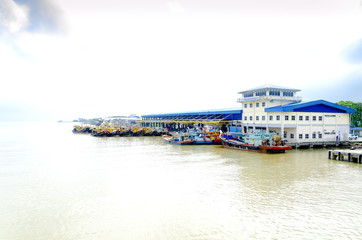 JOHOR, MALAYSIA - JANUARY 30, 2017: Fishing boats anchored at the jetty during the monsoon season at Endau, Johor, Malaysia. Endau is one of the most important fisheries in Johor.