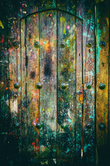 Paint splashes on weathered wooden door