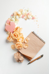 Roses and heart with notebook