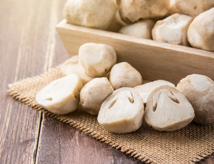 Straw mushrooms on wooden