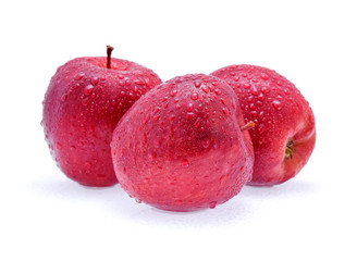 Red Apple with drops of water on white background