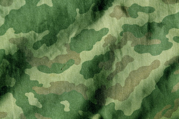 Weathered camouflage cloth texture.