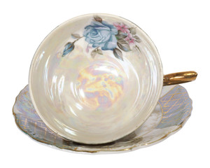 Antique tea cup, isolated on white. Beautiful porcelain.

