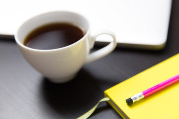 Obraz na płótnie Canvas Coffee cup, notebook and laptop