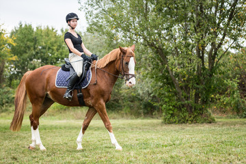 Young Woman Riding Her Horse