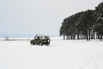 Russian jeep rides through the snow