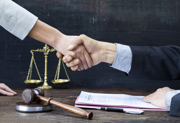 Handshake with justice gavel