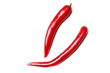 Red chili peppers lying on a white background. Not isolated.